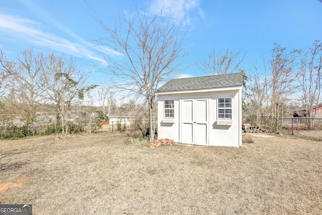 view of outdoor structure featuring a yard