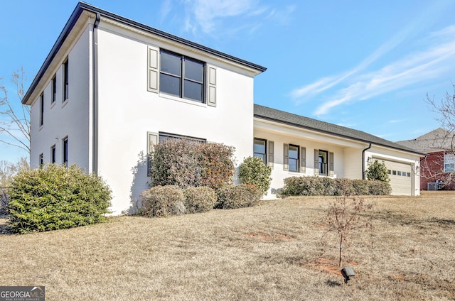 view of front facade with central AC unit and a garage