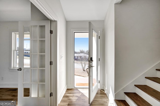 doorway to outside with hardwood / wood-style floors