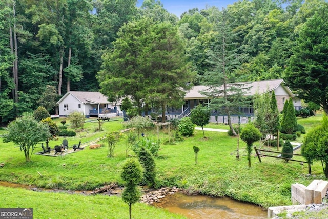 birds eye view of property featuring a water view