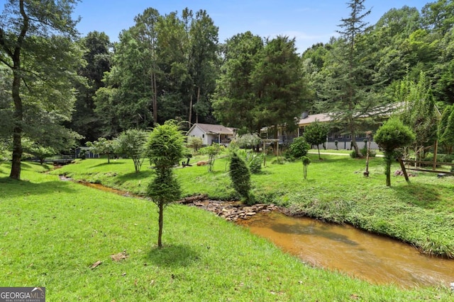 view of home's community featuring a yard