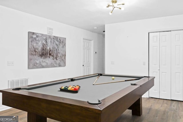 recreation room with hardwood / wood-style floors and billiards