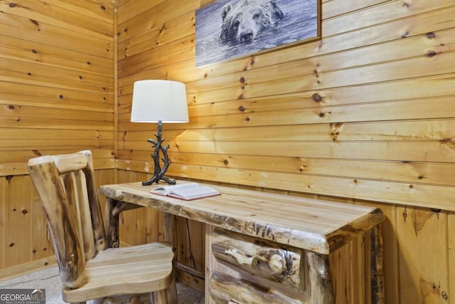 interior space featuring built in desk and wood walls