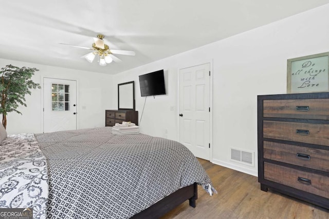 bedroom with wood-type flooring and ceiling fan