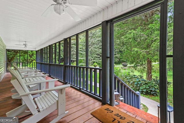 wooden deck with ceiling fan and a porch