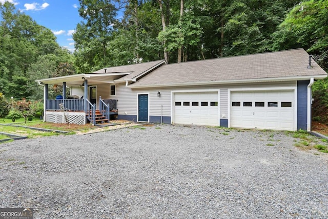 view of front of home with a garage and covered porch