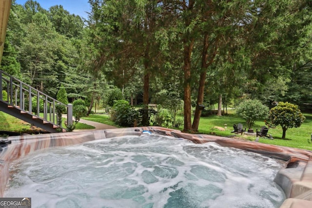 view of patio / terrace with a hot tub