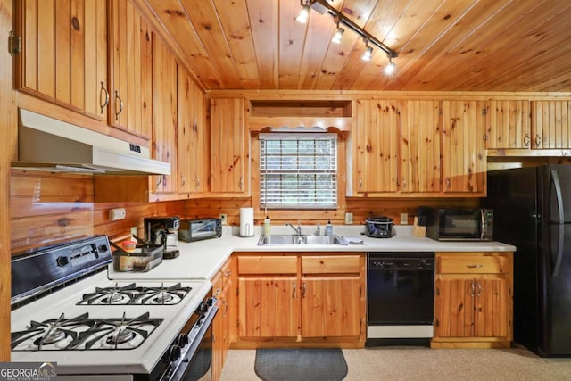 kitchen with sink, track lighting, black appliances, and wooden ceiling