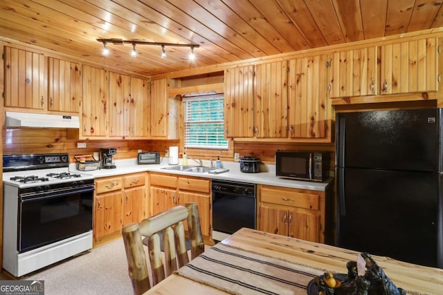 kitchen featuring rail lighting, sink, wood ceiling, light colored carpet, and black appliances