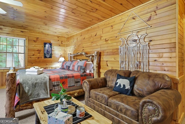 bedroom featuring carpet floors, wooden ceiling, and wooden walls