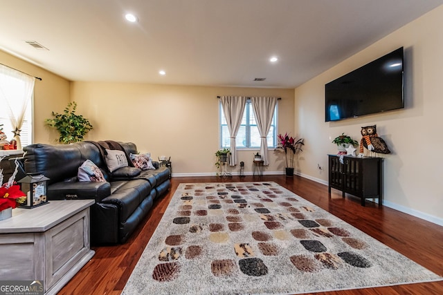 living room with dark hardwood / wood-style flooring