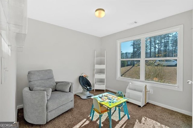 living area featuring carpet floors