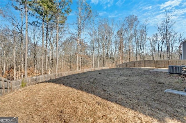 view of yard featuring central AC