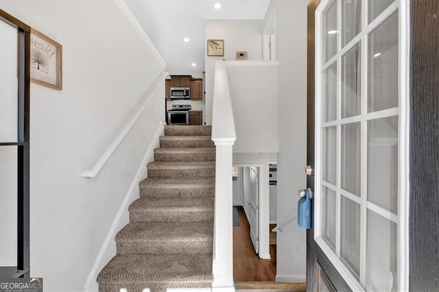 stairs with wood-type flooring