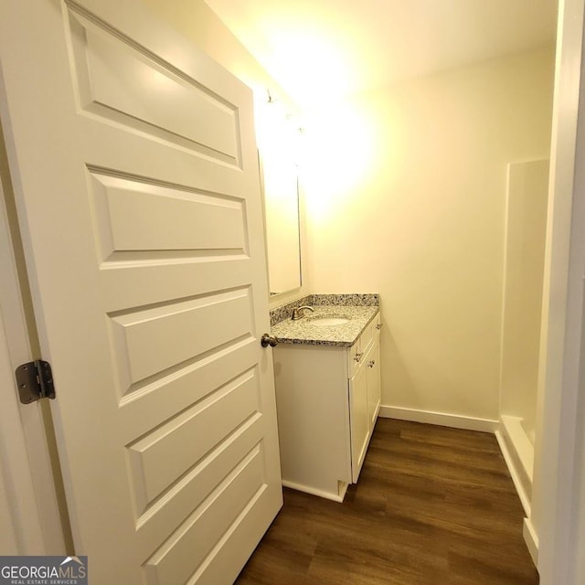 bathroom with vanity and hardwood / wood-style floors