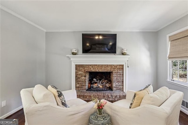 living room with ornamental molding, a fireplace, and dark hardwood / wood-style flooring