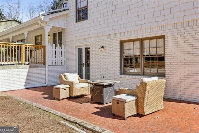 view of patio with a fire pit