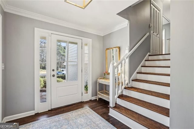 entrance foyer featuring crown molding and dark wood-type flooring