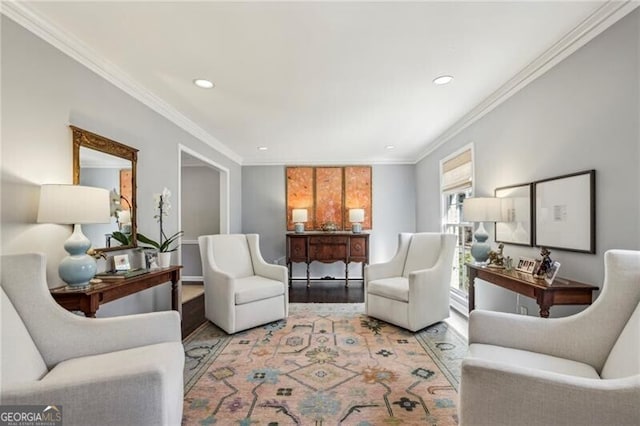 living area with ornamental molding and light wood-type flooring