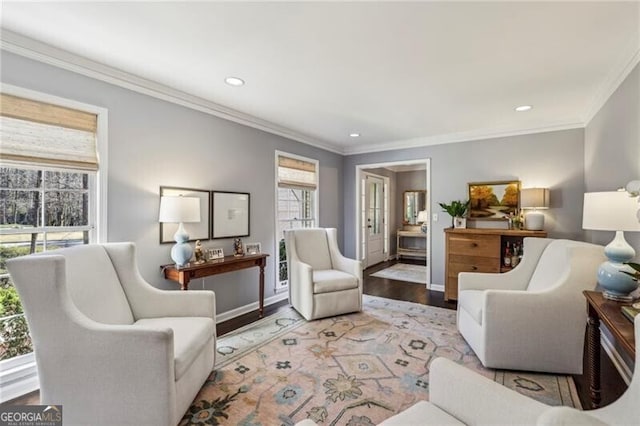 living room featuring hardwood / wood-style flooring and ornamental molding