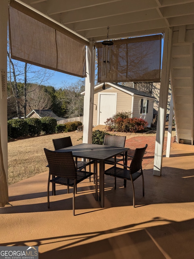 view of patio / terrace featuring a storage shed