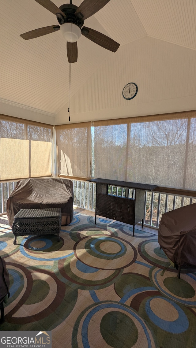 sunroom featuring vaulted ceiling