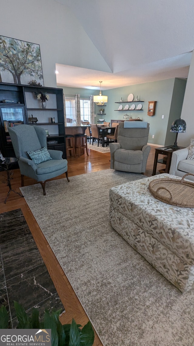 living room featuring hardwood / wood-style flooring and high vaulted ceiling