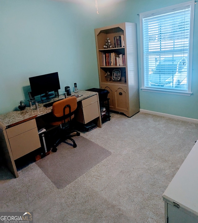 home office with light colored carpet