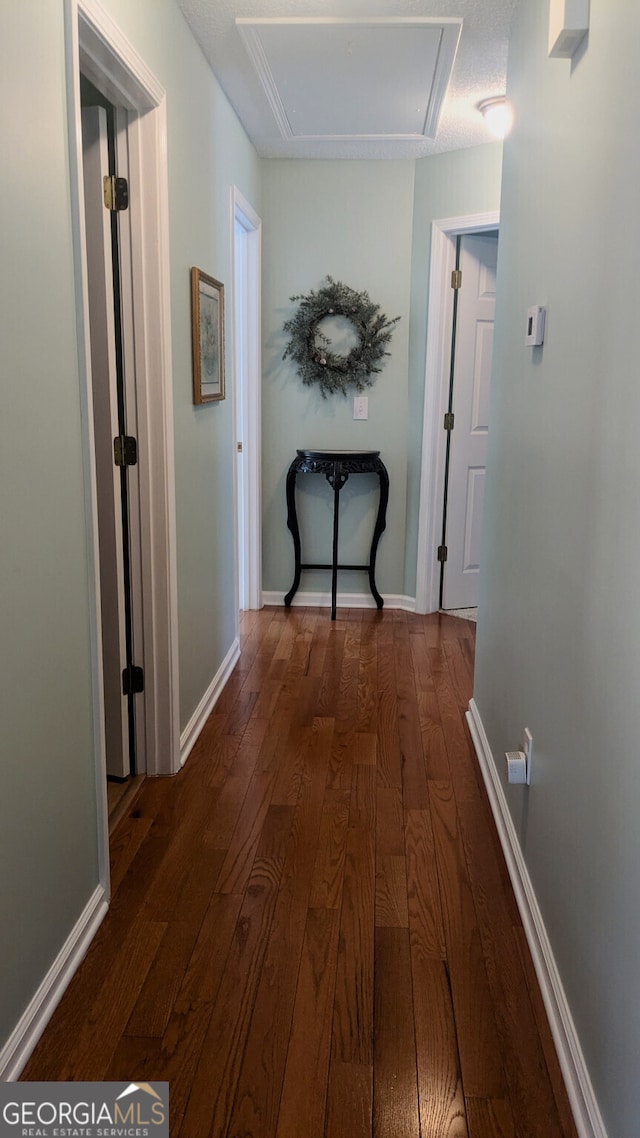 hall with dark wood-type flooring