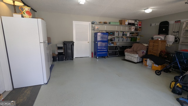 garage featuring white refrigerator