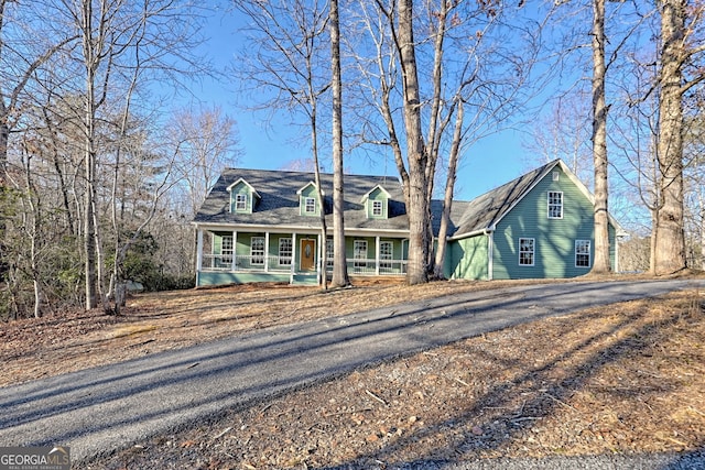 cape cod house with a porch