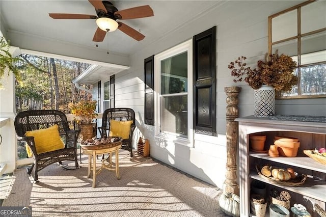 sunroom featuring plenty of natural light and ceiling fan