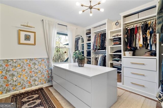 kitchen featuring hardwood / wood-style flooring, gray cabinets, and separate washer and dryer