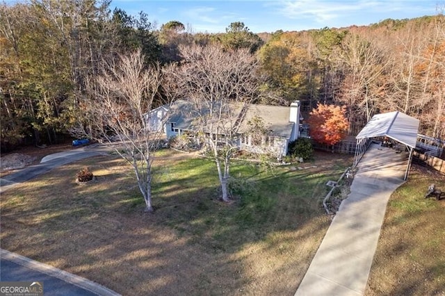 view of front facade with an outbuilding, a porch, a garage, and a front yard