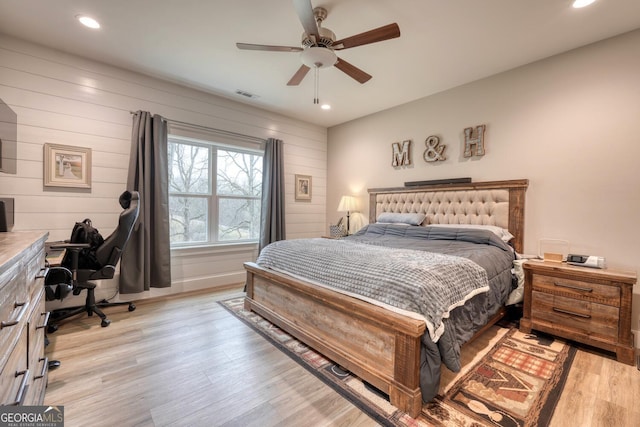 bedroom featuring ceiling fan and light hardwood / wood-style floors