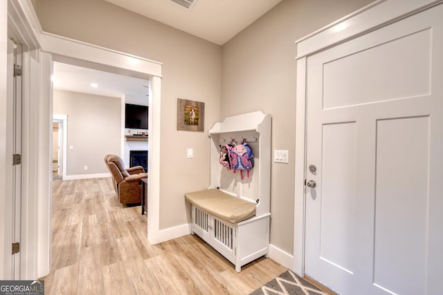 mudroom with light hardwood / wood-style floors