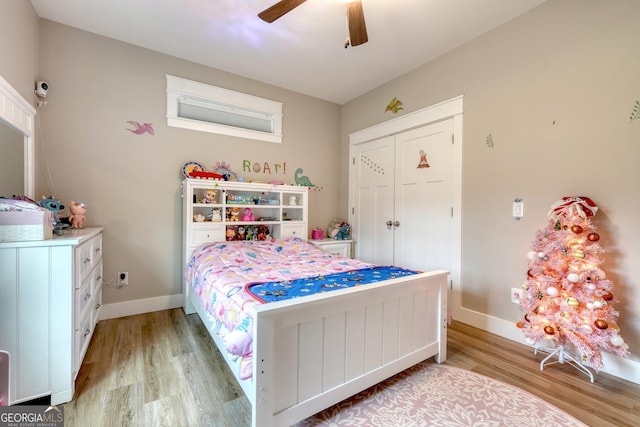 bedroom featuring a closet, ceiling fan, and light wood-type flooring