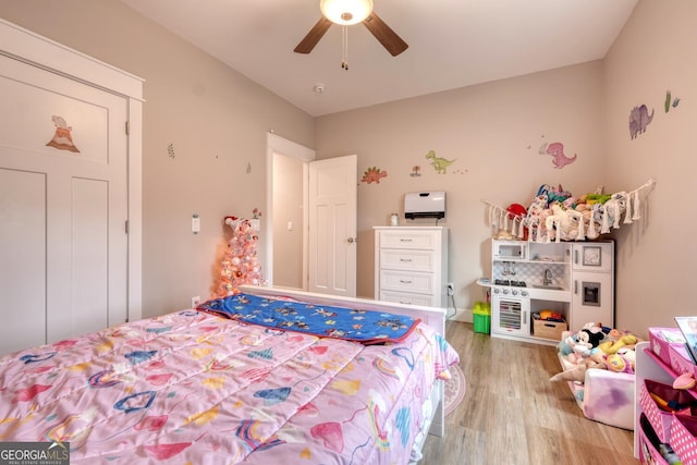 bedroom featuring ceiling fan and light wood-type flooring