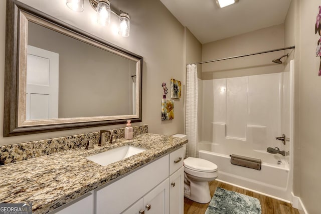 full bathroom with wood-type flooring, toilet, vanity, and shower / bath combo with shower curtain