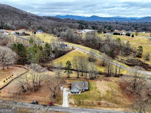 aerial view with a mountain view and a rural view