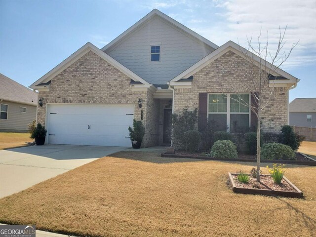 view of front of property with a garage and a front yard