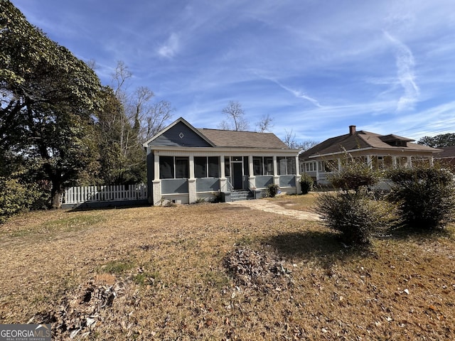 view of front of property with a sunroom