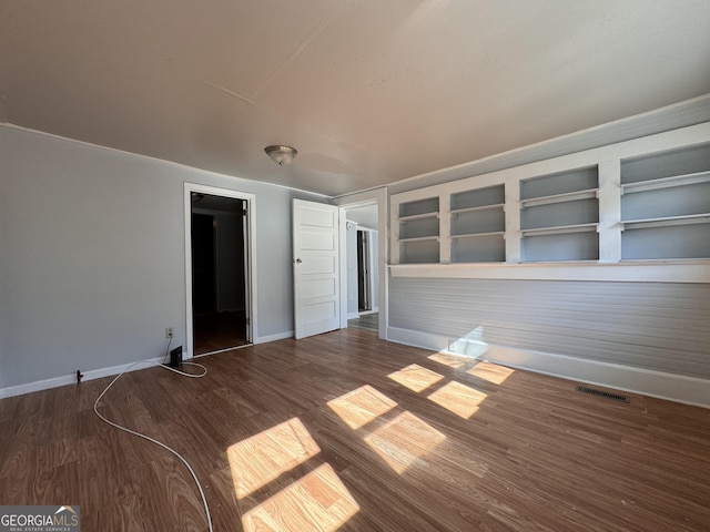 spare room featuring dark hardwood / wood-style floors