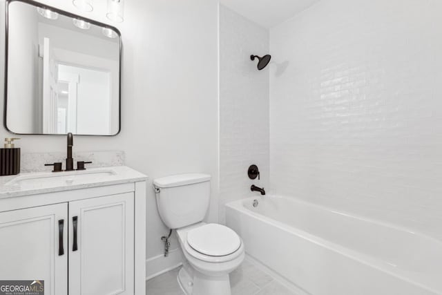 full bathroom with vanity, tile patterned flooring, toilet, and tiled shower / bath