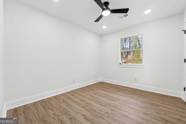 unfurnished room with hardwood / wood-style floors and ceiling fan