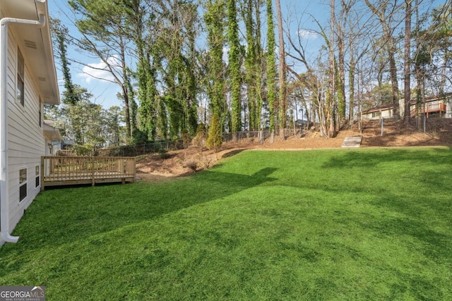 view of yard with a wooden deck