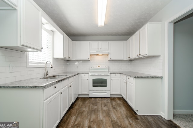 kitchen featuring electric stove, sink, white cabinetry, and light stone counters