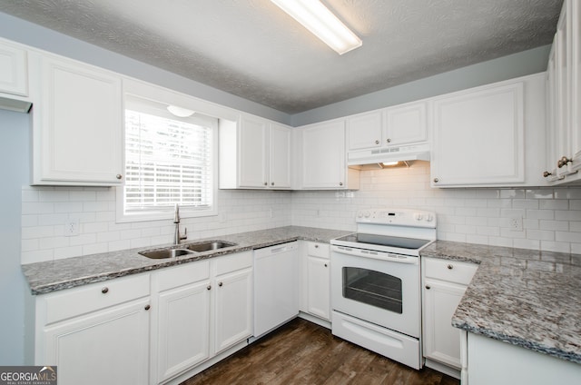 kitchen featuring stone counters, dark hardwood / wood-style floors, white cabinetry, sink, and white appliances