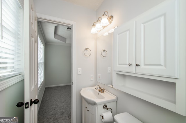 bathroom with vanity and toilet