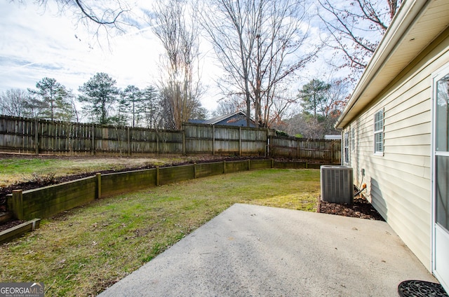 view of yard with a patio and central air condition unit